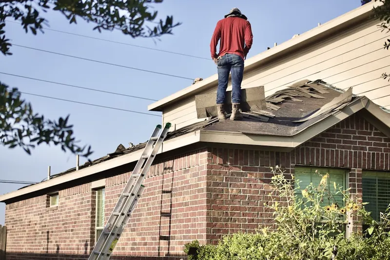 Professional roofer working on a residential roof in Biscayne Bay